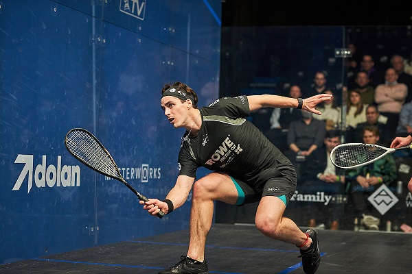 Paul Coll playing squash