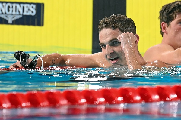 Lewis Clareburt celebrating his win in the pool